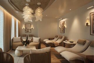 A serene wellness space featuring cozy lounge chairs, soft lighting, natural decor, and large windows for a calming atmosphere.